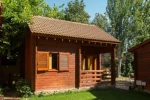 Wooden bungalow with a covered terrace, 1 km from beach